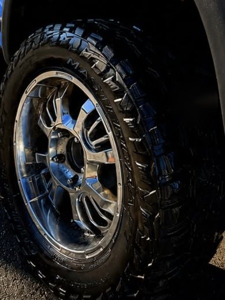 After: clean, glossy detailed tire and wheel
