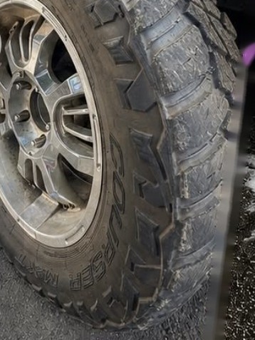 Before: dirty, dusty truck tire and wheel