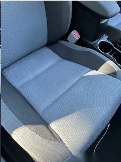 After: deep-cleaned car seat with stains removed
