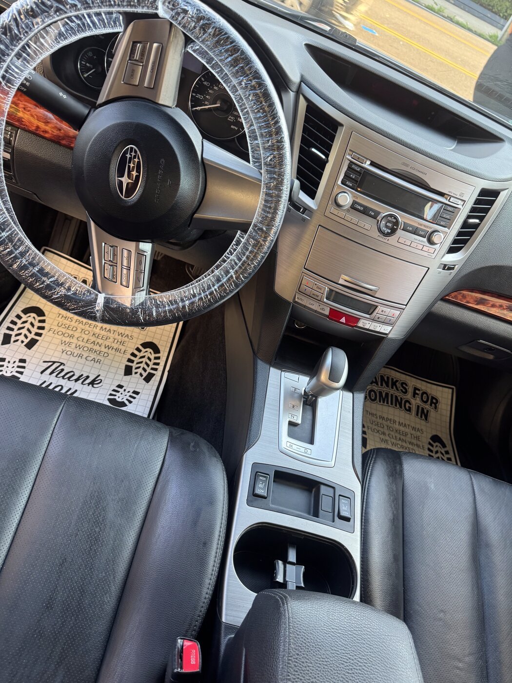 Immaculate dashboard, console, and cup holders after an interior detail