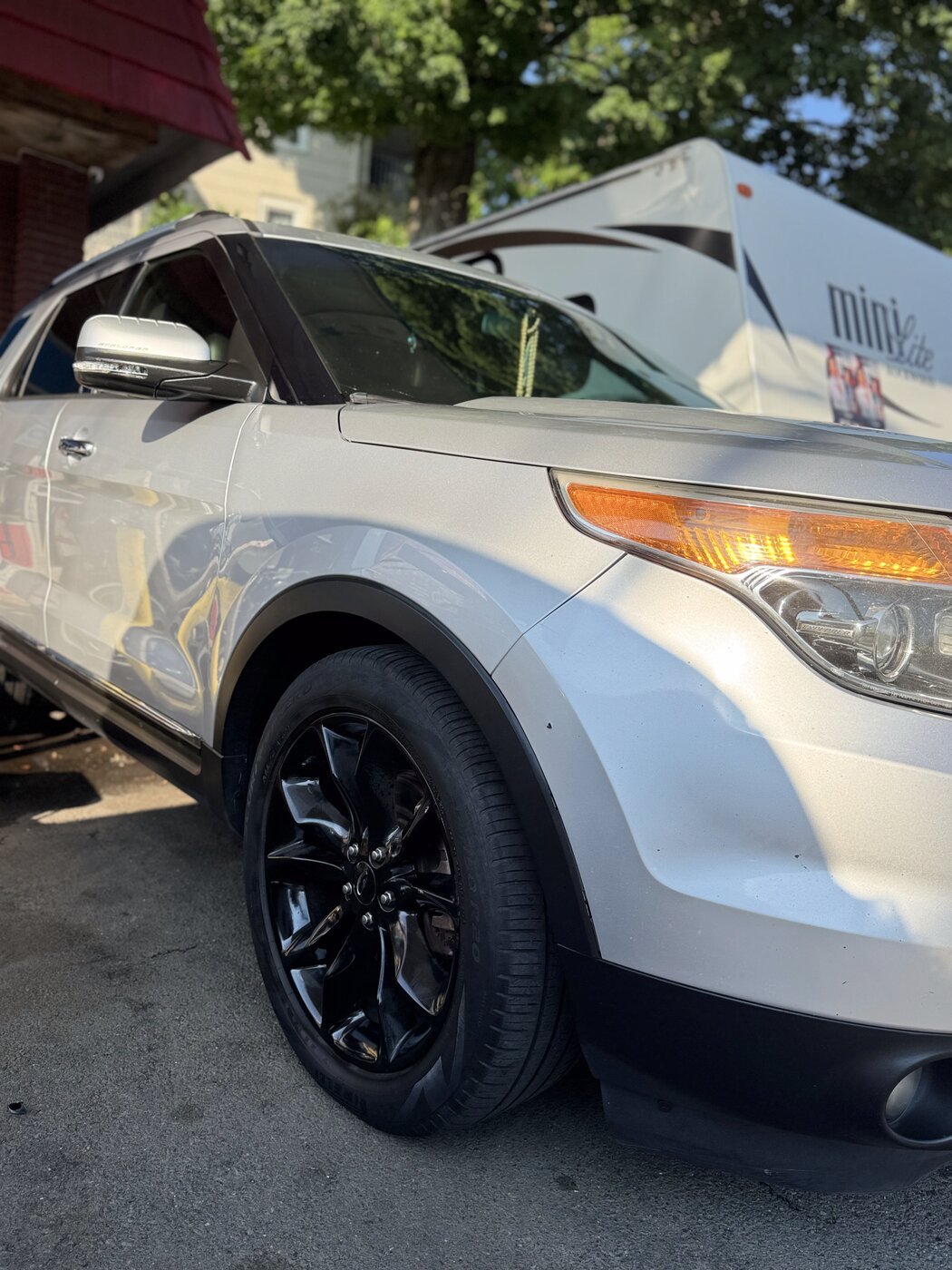 Clean wheel and fender close-up after an exterior detail