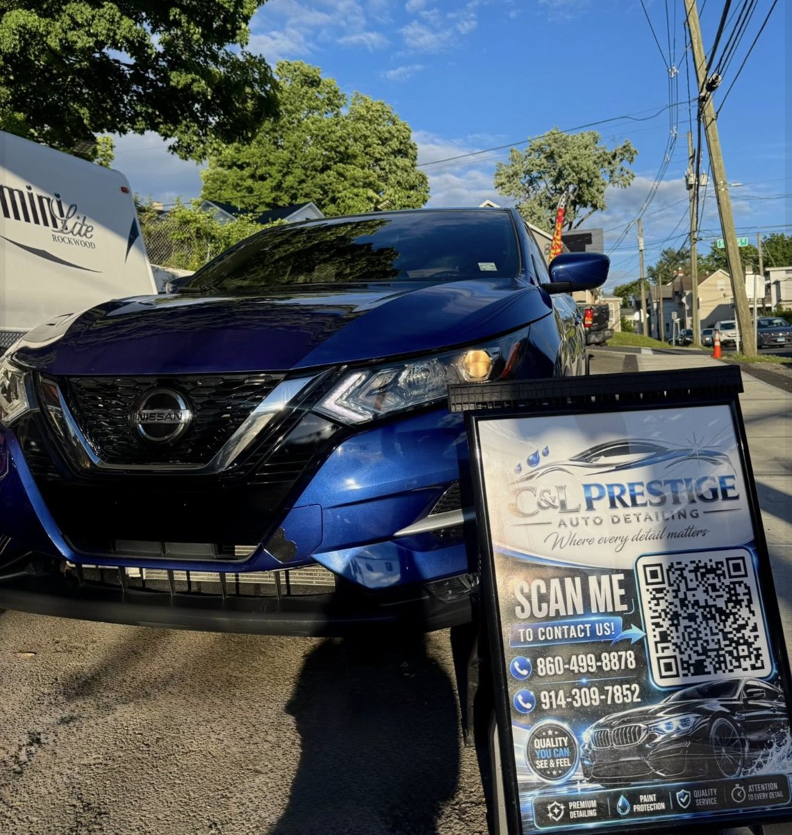 Freshly detailed SUV with the C&L Prestige sign board